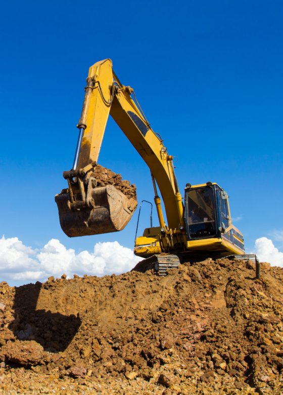 large-yellow-excavator-moving-dirt